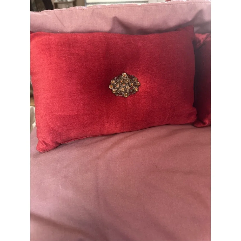Borgata red velvet throw pillow gold-toned vintage brooch pinned to the center